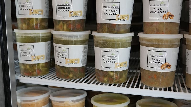 The soup fridge at a Stock & Sauce market stall, stocked with seven varieties
